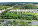 Beautiful aerial shot of the property showing a greenbelt in the back and the neighborhood's prime location at 8721 Firefly Pl, Parrish, FL 34219
