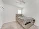 Bedroom featuring plush carpeting, gray quilted bedding, and white walls at 8721 Firefly Pl, Parrish, FL 34219