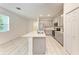 Modern kitchen featuring white cabinets, stainless steel appliances and light countertops at 8721 Firefly Pl, Parrish, FL 34219