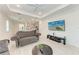 Open-concept living room with kitchen featuring a decorative ceiling fan at 8721 Firefly Pl, Parrish, FL 34219