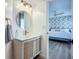A bright bathroom includes a modern vanity, gold fixtures, and a view into the bedroom at 912 Ponderosa Pine Ln, Sarasota, FL 34243
