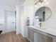 Modern bathroom with a stylish vanity, round mirror, and chic accents, providing a relaxing atmosphere at 912 Ponderosa Pine Ln, Sarasota, FL 34243