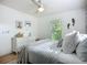 Bright bedroom featuring white decor, natural light, and a ceiling fan, creating a refreshing ambiance at 912 Ponderosa Pine Ln, Sarasota, FL 34243