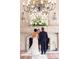 Wedding ceremony in front of elegant stone fireplace at 912 Ponderosa Pine Ln, Sarasota, FL 34243