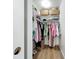 Organized closet with shelves, hanging rods, and woven baskets at 912 Ponderosa Pine Ln, Sarasota, FL 34243