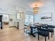 Eat in dining area features a black table and view of the backyard pool at 912 Ponderosa Pine Ln, Sarasota, FL 34243