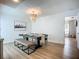 Staged dining table beneath a decorative chandelier is ready for new owners at 912 Ponderosa Pine Ln, Sarasota, FL 34243