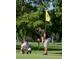 Personal putting on lush community golf course at 912 Ponderosa Pine Ln, Sarasota, FL 34243