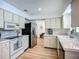 Well lit kitchen with stainless steel appliances and neutral-colored cabinets at 912 Ponderosa Pine Ln, Sarasota, FL 34243