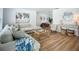 Bright living room with wood floors and coastal decor at 912 Ponderosa Pine Ln, Sarasota, FL 34243