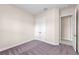 This bedroom features plush carpeting, fresh paint, and a double door closet at 10309 Longmeadow Ave, Parrish, FL 34219