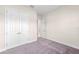 This bedroom features plush carpeting, fresh paint, and a double door closet at 10309 Longmeadow Ave, Parrish, FL 34219