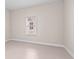 Bright bedroom features tile floor and window with blinds at 10309 Longmeadow Ave, Parrish, FL 34219