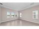 Bright, tiled bedroom with natural light, views of the water, and modern design at 10309 Longmeadow Ave, Parrish, FL 34219