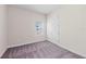 An empty bedroom with a window and closet door, ready for personalization and decoration at 10309 Longmeadow Ave, Parrish, FL 34219