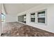The open-air patio features brick pavers, a large sliding glass door, and recessed lighting at 10309 Longmeadow Ave, Parrish, FL 34219