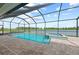 Enjoy this beautiful pool and spa with stunning lake views under a screened-in enclosure at 10309 Longmeadow Ave, Parrish, FL 34219