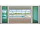 Inviting screened-in pool and spa overlook the serene waterfront view from the brick-paved patio at 10309 Longmeadow Ave, Parrish, FL 34219