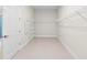 Spacious walk-in closet with wire shelving and ample storage space for clothes and accessories at 10309 Longmeadow Ave, Parrish, FL 34219