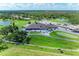 Panoramic aerial view highlighting the clubhouse, golf course, and surrounding greenery, blending luxury and natural beauty at 11915 Oak Ridge Dr, Parrish, FL 34219