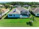 Aerial shot of a home showcasing a screened-in pool, lush backyard, and neighborhood at 11915 Oak Ridge Dr, Parrish, FL 34219