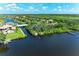 Overhead view of waterfront homes with private docks and waterway access at 11915 Oak Ridge Dr, Parrish, FL 34219