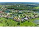 Aerial view of a beautiful suburban neighborhood with lush green landscaping and serene ponds at 11915 Oak Ridge Dr, Parrish, FL 34219
