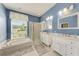 Bright primary bathroom with garden tub, and walk-in shower at 11915 Oak Ridge Dr, Parrish, FL 34219