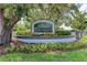 Elegant community entrance sign with lush landscaping, welcoming you to this deed-restricted community at 11915 Oak Ridge Dr, Parrish, FL 34219