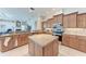 Spacious kitchen with stainless steel appliances, an island, and granite countertops at 11915 Oak Ridge Dr, Parrish, FL 34219
