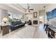 Cozy living room with a large window overlooking the screened lanai and pool at 11915 Oak Ridge Dr, Parrish, FL 34219