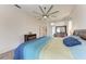 Spacious main bedroom with a ceiling fan, and large dresser at 11915 Oak Ridge Dr, Parrish, FL 34219