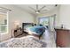 Spacious main bedroom with a ceiling fan, and a sliding glass door at 11915 Oak Ridge Dr, Parrish, FL 34219