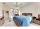Spacious main bedroom with a ceiling fan, and large dresser at 11915 Oak Ridge Dr, Parrish, FL 34219