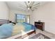 Spacious main bedroom with a ceiling fan, and a view to the pool at 11915 Oak Ridge Dr, Parrish, FL 34219