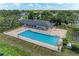 Relaxing community pool with plenty of lounge chairs and tables, perfect for enjoying sunny days in the neighborhood at 11915 Oak Ridge Dr, Parrish, FL 34219