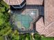 Aerial view of a luxury home featuring a screened in pool, landscaped grounds, and a gorgeous tile roof at 12448 Highfield Cir, Lakewood Ranch, FL 34202