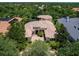 Aerial view of the home showing the tile roof, pool and mature landscaping at 12448 Highfield Cir, Lakewood Ranch, FL 34202