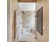 Modern bathroom showcasing a tiled shower with a glass door and sleek fixtures, creating a spa-like retreat at 12448 Highfield Cir, Lakewood Ranch, FL 34202