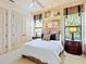 Inviting bedroom with a comfortable bed, stylish side tables, and a bright window view with accent decor at 12448 Highfield Cir, Lakewood Ranch, FL 34202