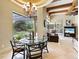 Dining area with pool view, chandelier, and an open layout at 12448 Highfield Cir, Lakewood Ranch, FL 34202