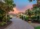 Beautiful home with mature tropical landscaping, brick drive and a tile roof at 12448 Highfield Cir, Lakewood Ranch, FL 34202