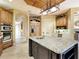 Spacious kitchen with a large center island, granite countertops, and custom cabinetry at 12448 Highfield Cir, Lakewood Ranch, FL 34202
