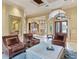 Spacious living room that leads to a dining area with a clear view of the home's front entrance at 12448 Highfield Cir, Lakewood Ranch, FL 34202
