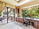 Bright office space boasts a large window overlooking lush greenery, custom cabinetry, and a comfortable workspace at 12448 Highfield Cir, Lakewood Ranch, FL 34202