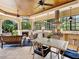 Outdoor living space with a fireplace, barbecue, and plenty of seating for entertaining friends and Gathering at 12448 Highfield Cir, Lakewood Ranch, FL 34202