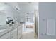 Bathroom features a granite countertop with double sinks and access to the bedroom at 13805 Posada St, Venice, FL 34293