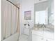 A cozy bathroom featuring a tub and shower combination, vanity, and toilet at 13805 Posada St, Venice, FL 34293
