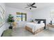 Serene bedroom with large window, neutral color palette, and view of the water at 13805 Posada St, Venice, FL 34293