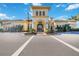 Community clubhouse featuring architectural details and ample parking, welcoming residents to enjoy the amenities at 13805 Posada St, Venice, FL 34293